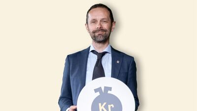 Finansbyråden holder i et symbol for samfunnsfloken "Fattigdom og økt ulikhet".