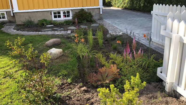 Regnbed med stakitt
