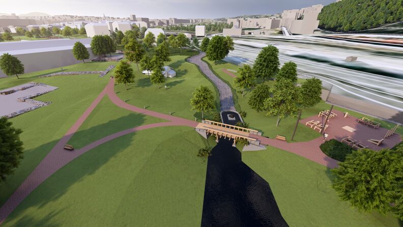 Grønn park, bro og elv.
