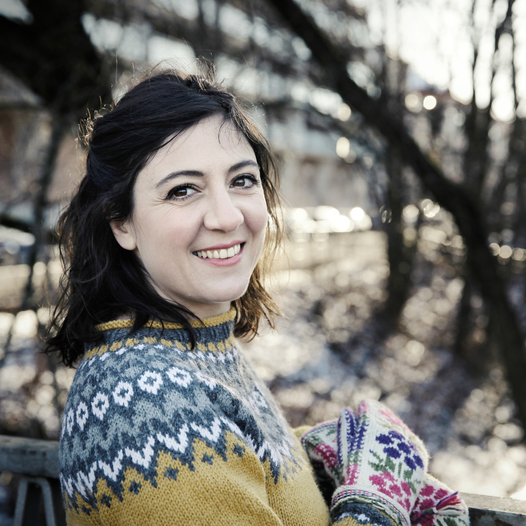 A photo of a woman smiling at the camera