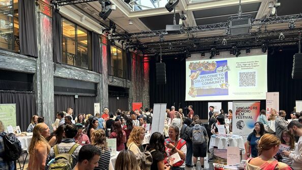 photo of a large room fillde with people