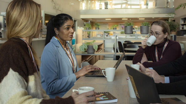 People sitting around a table at the kantine